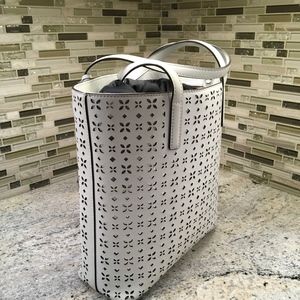 White backed with silver Micheal Kors bag